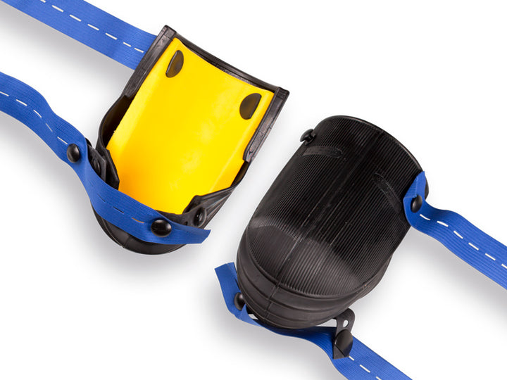 Kniebeschermer NIERHAUS harmonica lang, type 13-VE. Rubber met geel ergonomisch kussen, en blauwe riemen